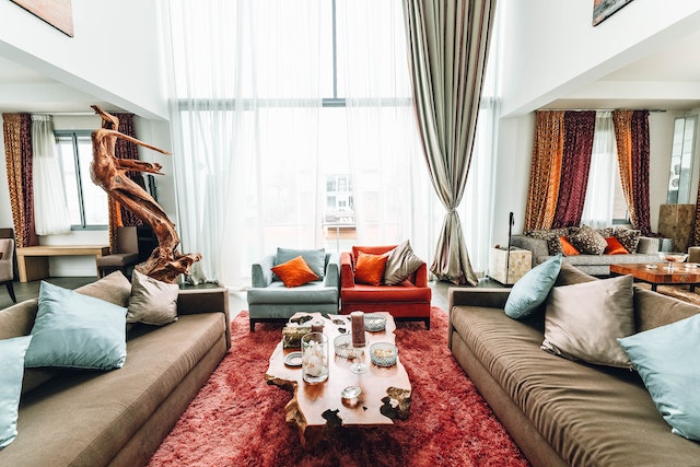 red-furniture-in-living-room-rental-with-big-windows